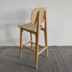 Back view of beech wood bar stool showing solid wood frame and cross-bar support