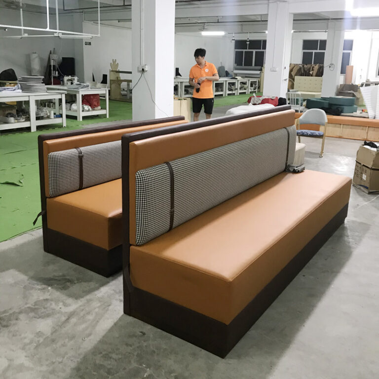 Upholstered restaurant booth with houndstooth detail in Dejell factory production