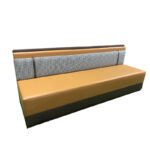 Upholstered restaurant booth with houndstooth fabric back and leather straps on white background