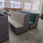 Commercial restaurant booth seating ready for shipment in green and beige by Dejell