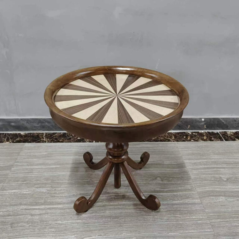 Round ash wood side table with sunburst pattern top and scrolled feet side view