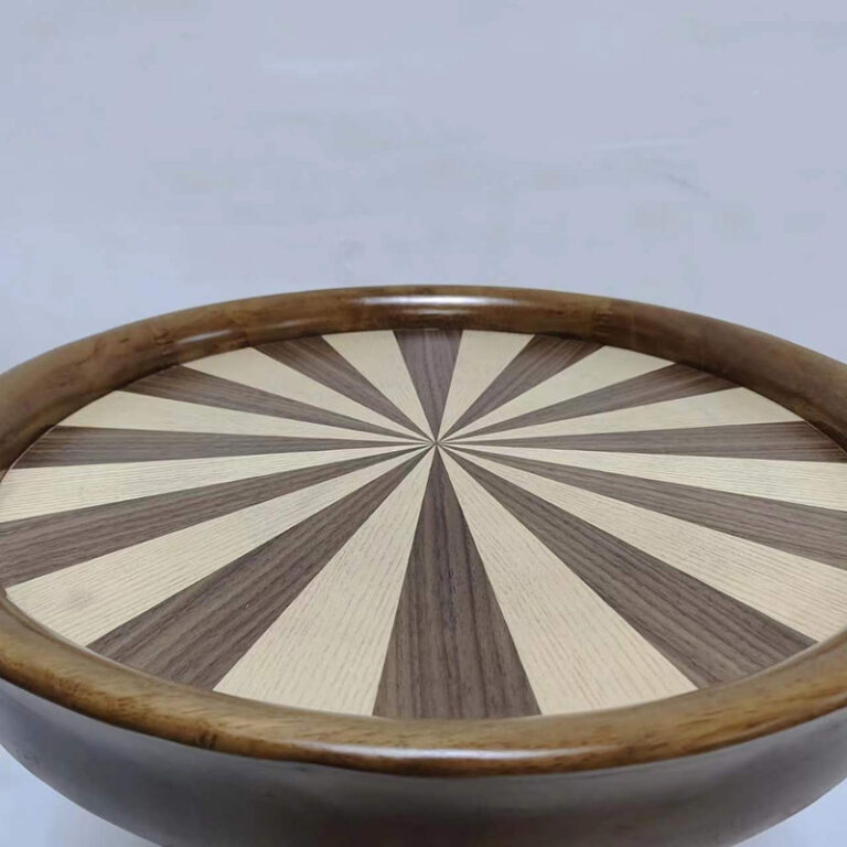 Close-up of sunburst ash wood veneer tabletop with alternating light and dark pattern