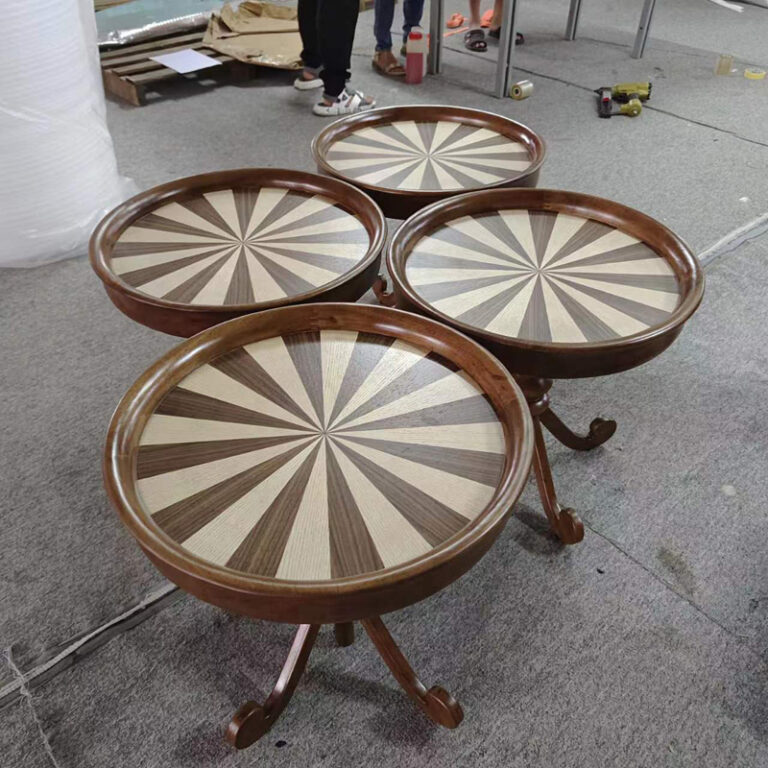 Multiple ash wood round side tables in production at Dejell factory