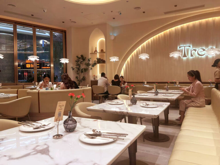 Custom dining chairs and booth seating in use at Shenzhen restaurant by Dejell
