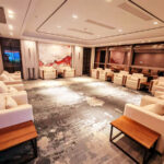 white conference sofa and walnut side table in chamber meeting room by Dejell