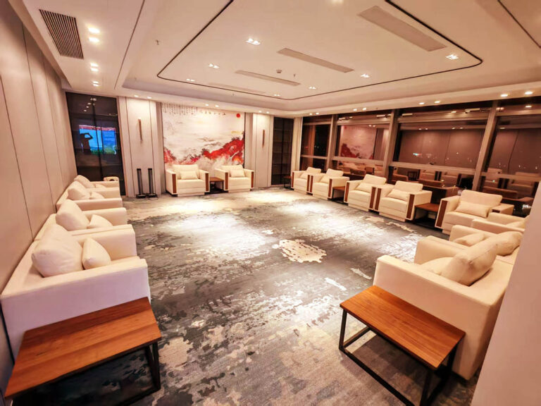 white conference sofa and walnut side table in chamber meeting room by Dejell