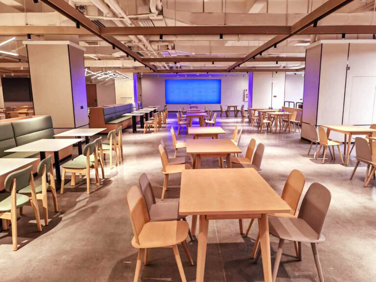 Full view of corporate canteen with multiple dining zones by Dejell