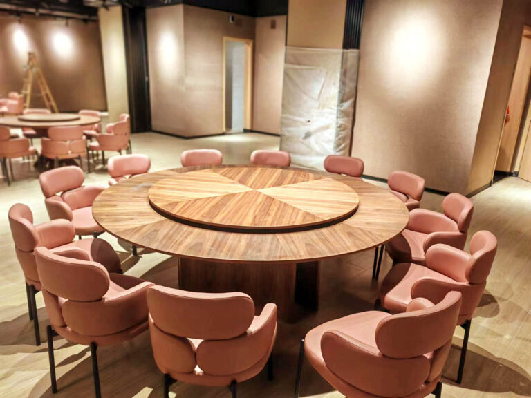 Round banquet table with 12 leather chairs for executive dining by Dejell