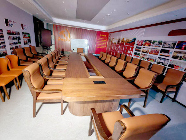 white conference sofa and walnut side table in chamber meeting room by Dejell
