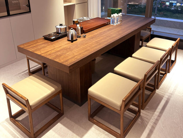 Solid wood tea table with built-in tea station and cushioned stools by Dejell