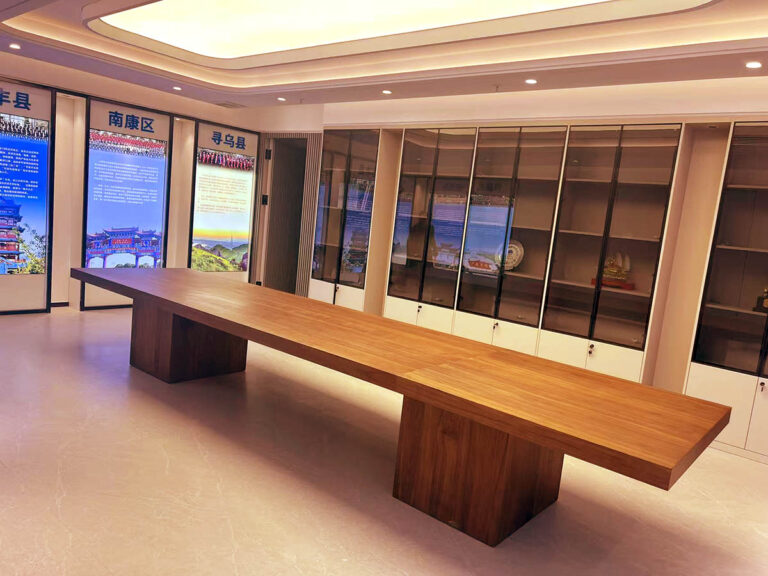 Display table with glass cabinets and regional exhibition boards by Dejell
