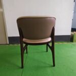 Dejell cream white dining chair back view showing curved backrest and walnut frame