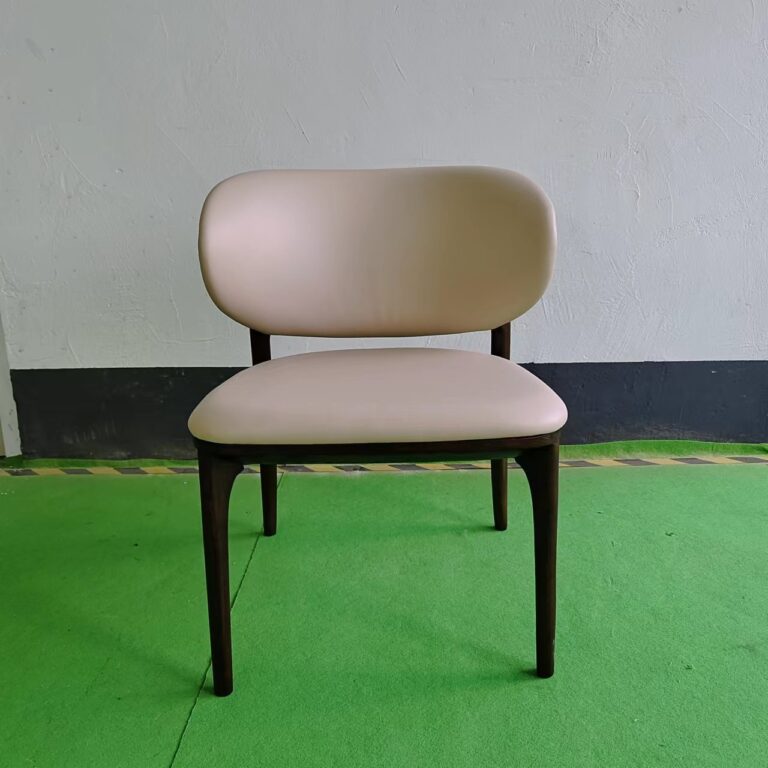 Dejell cream white upholstered dining chair with asymmetric curved backrest and solid walnut wood frame - front view