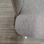 Dejell GD-W106 dining chair textured fabric seat close-up showing weave pattern and leather edge stitching