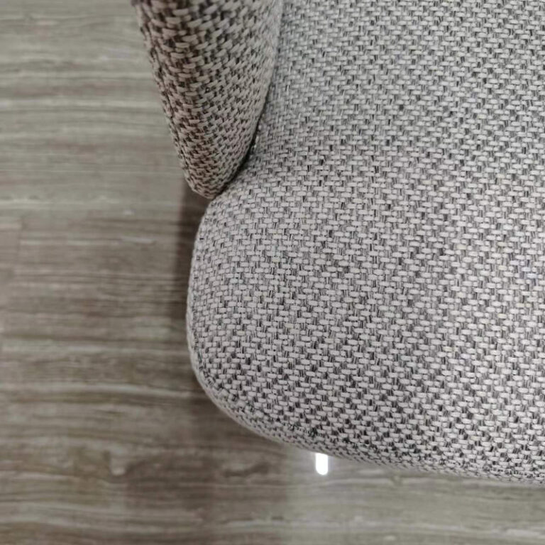 Dejell GD-W106 dining chair textured fabric seat close-up showing weave pattern and leather edge stitching