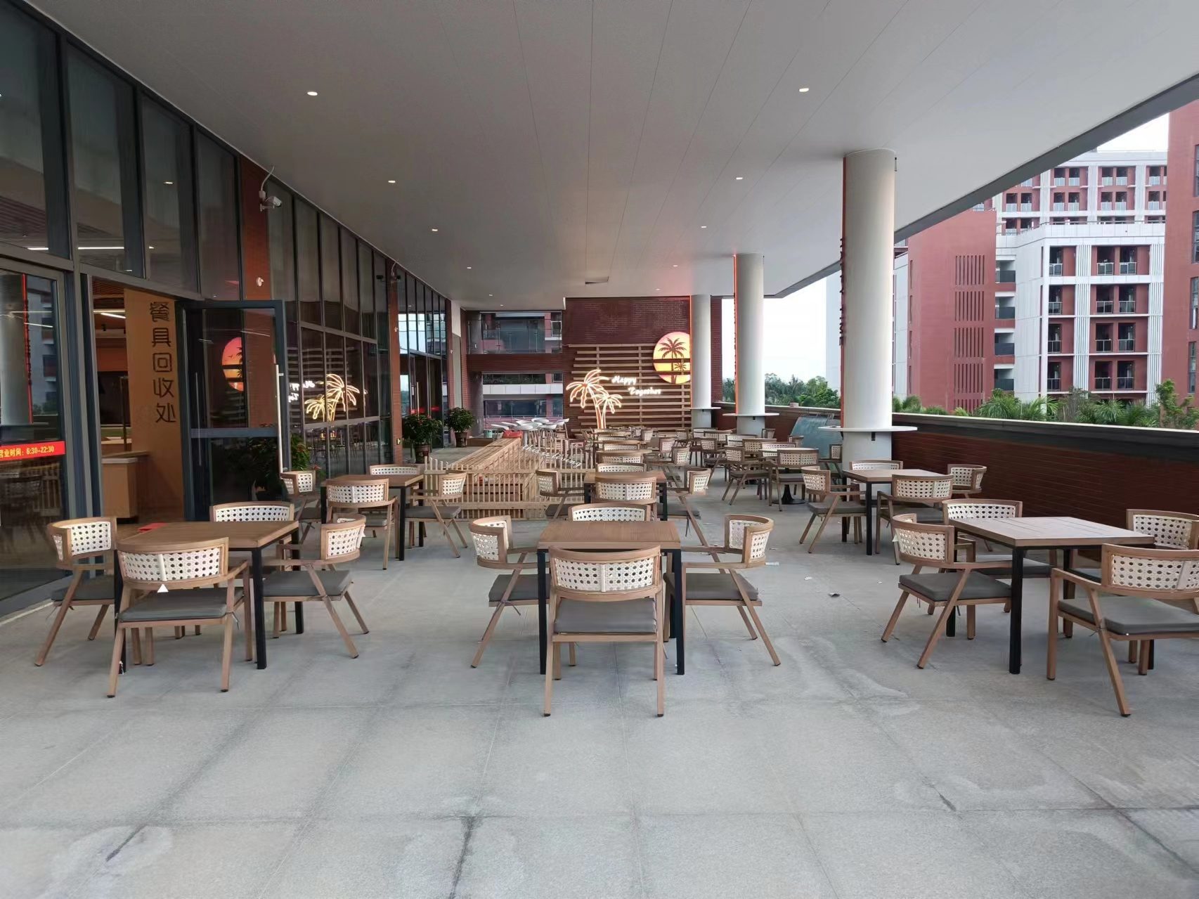 Covered terrace seating along the dining hall building
