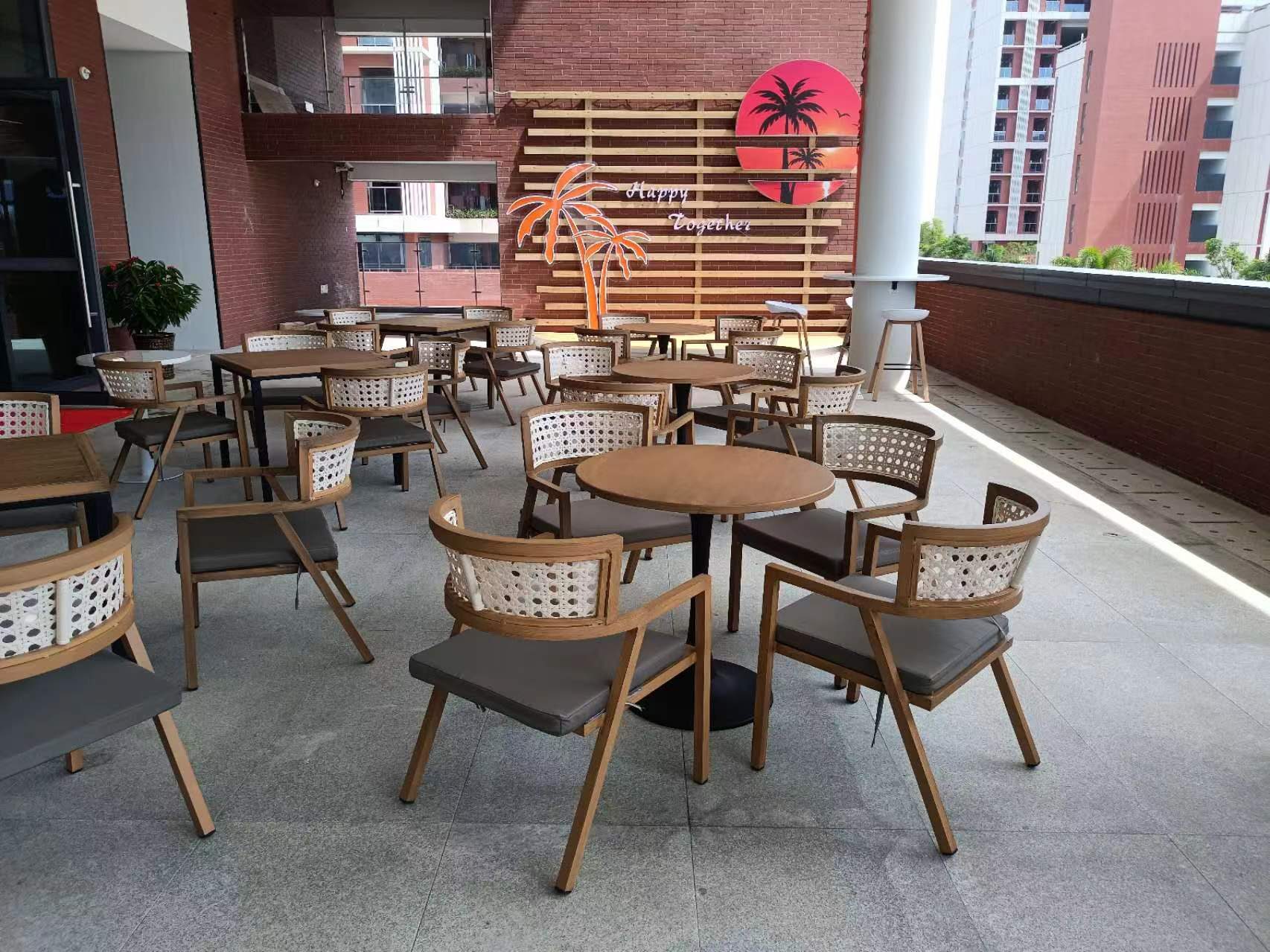 Rooftop terrace with palm-feature wall and rattan chairs