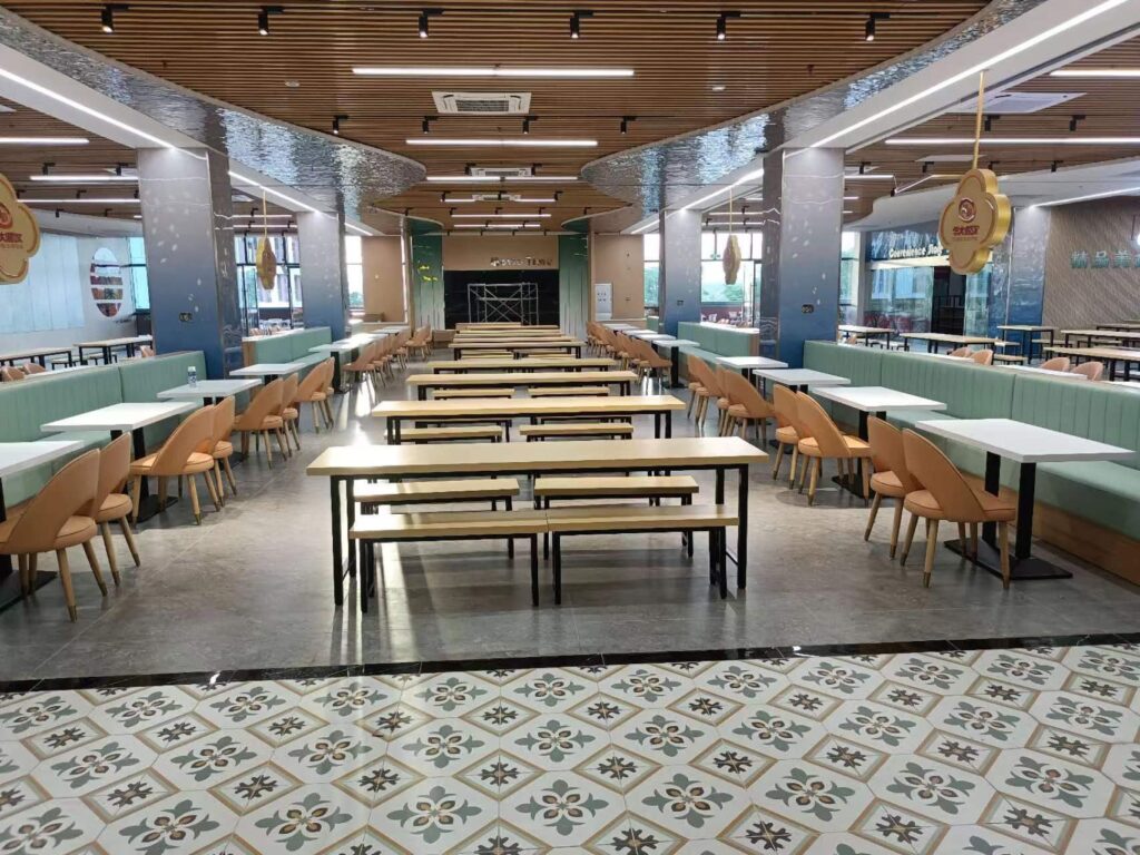 Main dining hall of Hainan University Dining Hall No. 1 with communal tables and green booths