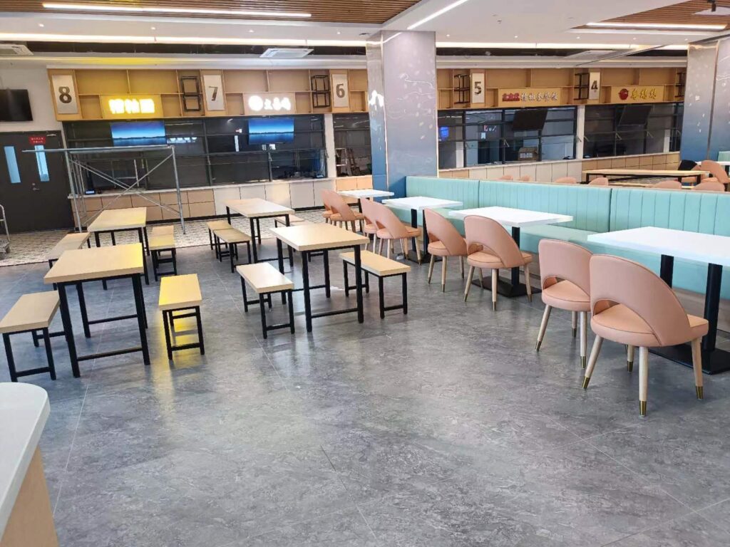 Upholstered booth seating zones in Hainan University dining hall
